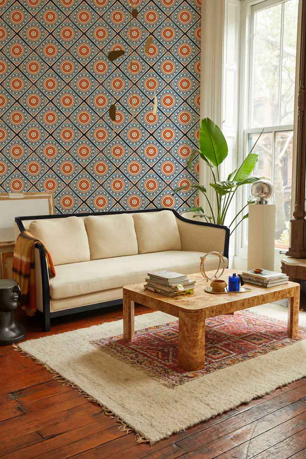 A blue and orange repeat pattern wallpaper mural creates a singular look for the space.