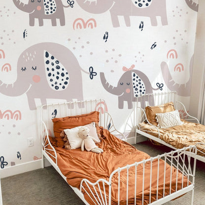 Wallpaper mural featuring a cartoon elephant in pastel colours, ideal for use as a bedroom decoration