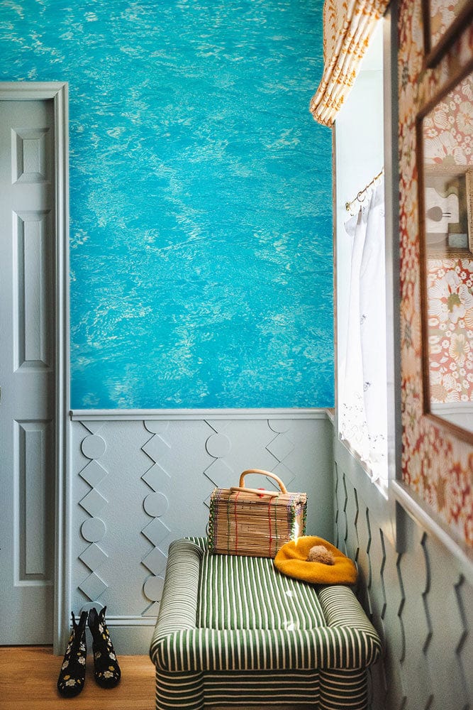 Wallpaper mural depicting a clear blue pool for use in decorating the hallway