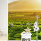 Wallpaper mural featuring a quaint grassland scene, ideal for use in decorating a nursery.