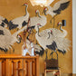 Decorate Your Hallway with This Mural of Cranes on Yellow Wallpaper