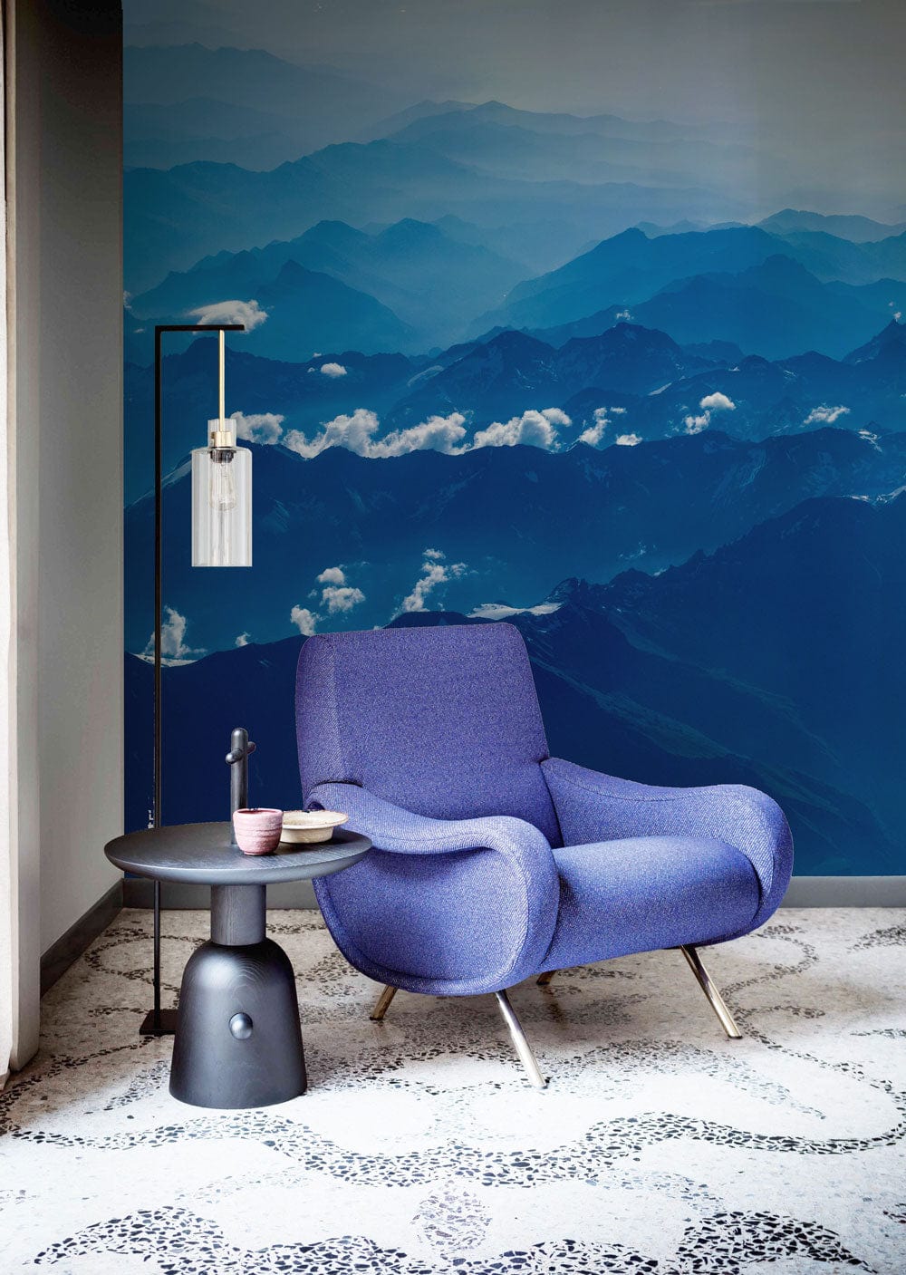 Wallpaper mural featuring a scene of dark blue mountains for use in decorating the hallway
