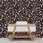 Wallpaper mural with a dark terrazzo pattern for the decor of the hallway