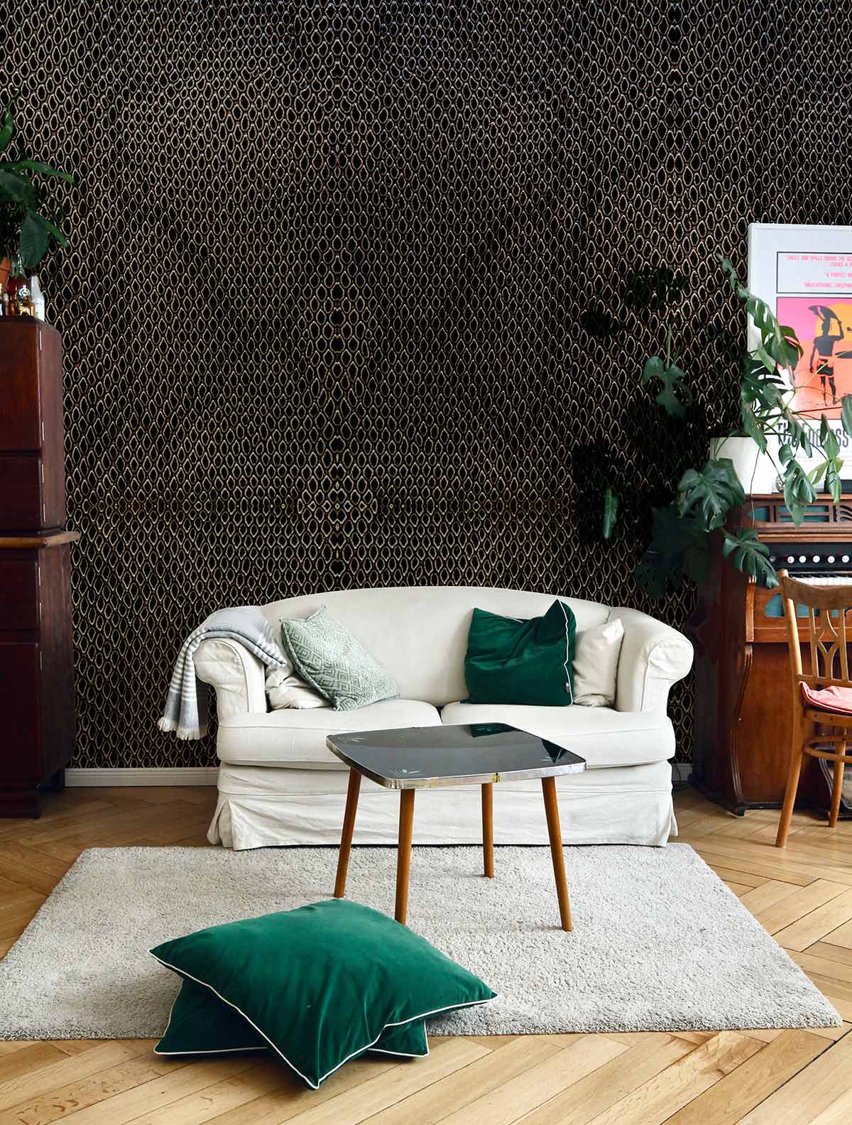 A wallpaper mural with a deep black python skin texture is perfect for use in the living room.