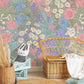 Wallpaper mural featuring a dreamy arrangement of dense flowers for use in decorating nurseries