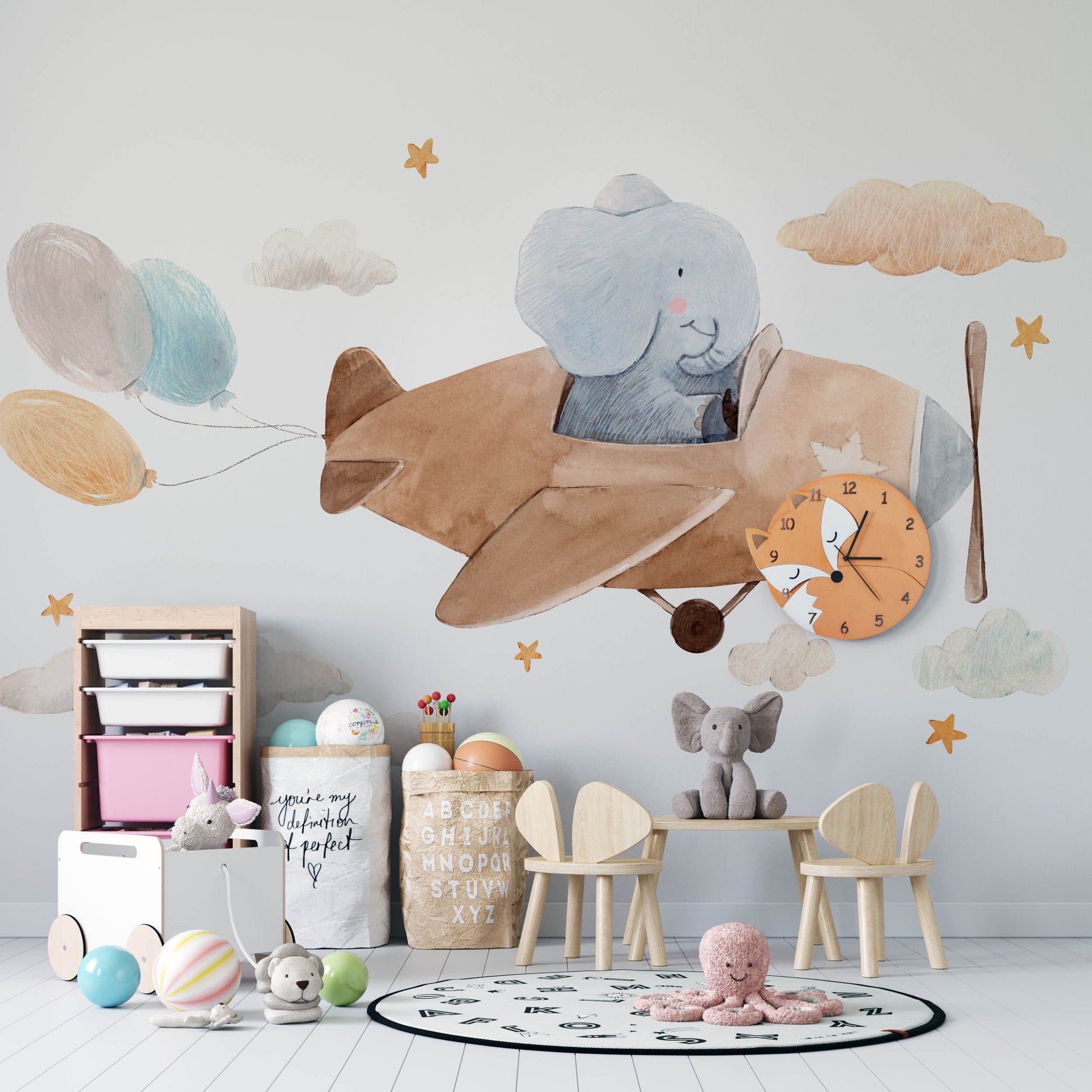 Wallpaper mural featuring an elephant flying a plane for a child's room.