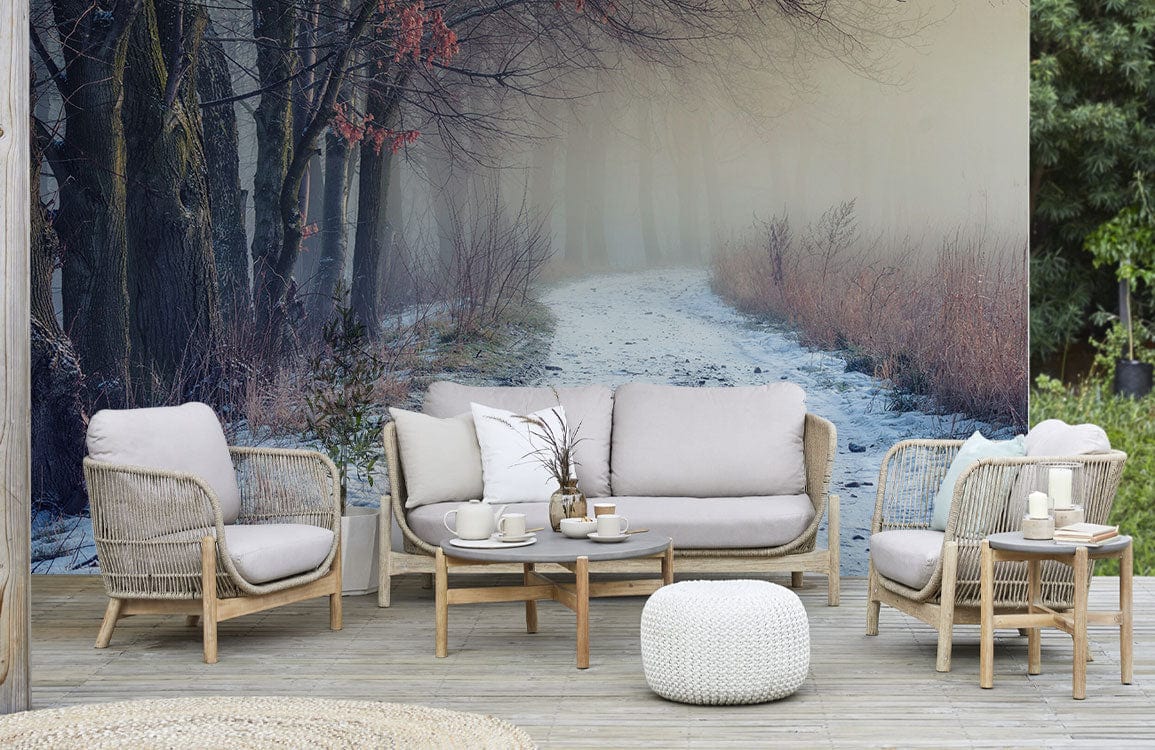 A snow-covered path in the forest is shown on a wallpaper mural for the living room