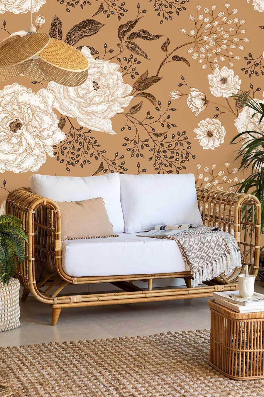 a couch with a flower and leaf pattern on the wallpaper