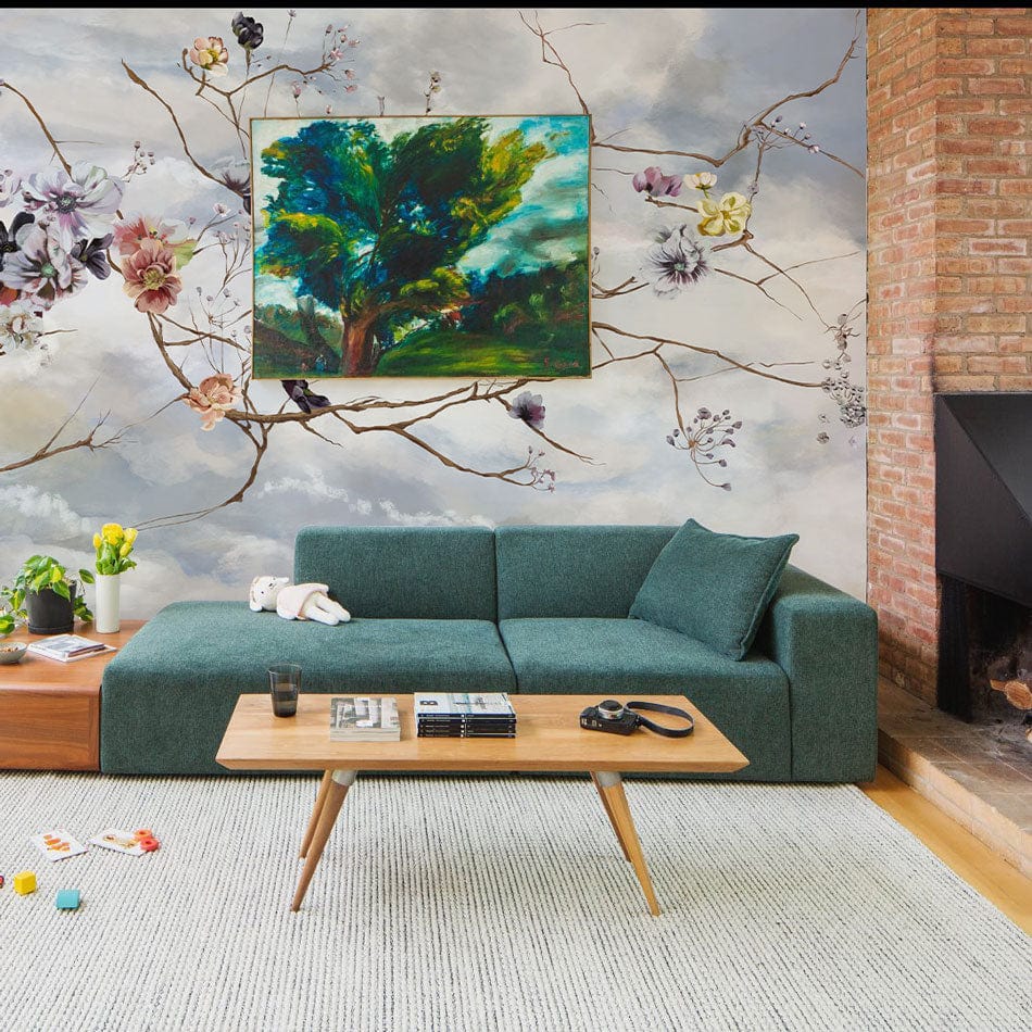 a floral branch and bloom wallpaper mural for use in decorating the living room.