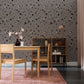 Wallpaper mural with a terrazzo pattern in grey for use in home or office decor.