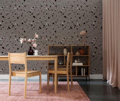 Wallpaper mural with a terrazzo pattern in grey for use in home or office decor.