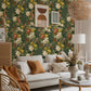 The living room's decor is a green bouquet of vines on a wall mural