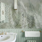 Wallpaper mural with feathers and leaves in green for use as bathroom decor.