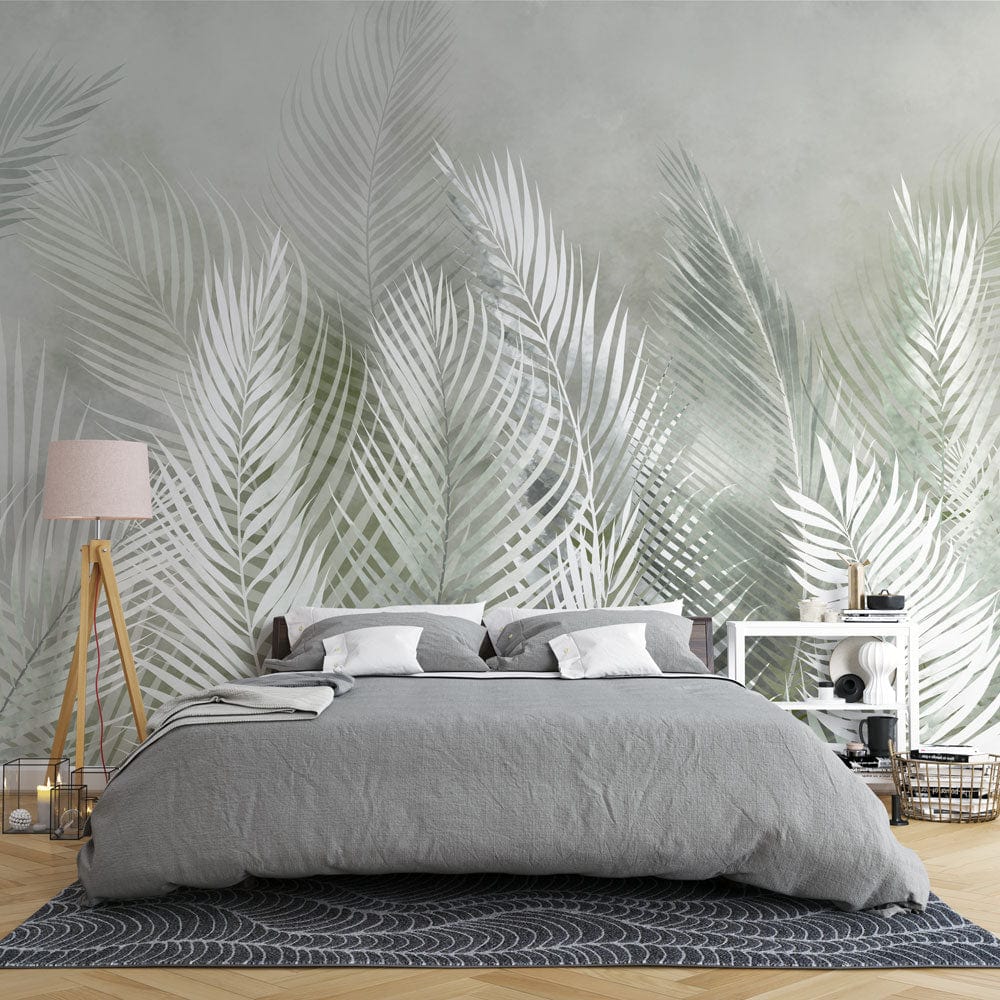 Wallpaper mural with feathers and leaves in green for use as bedroom decor.