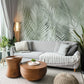 Mural wallpaper design featuring feathers and leaves in green for use as living room decor.