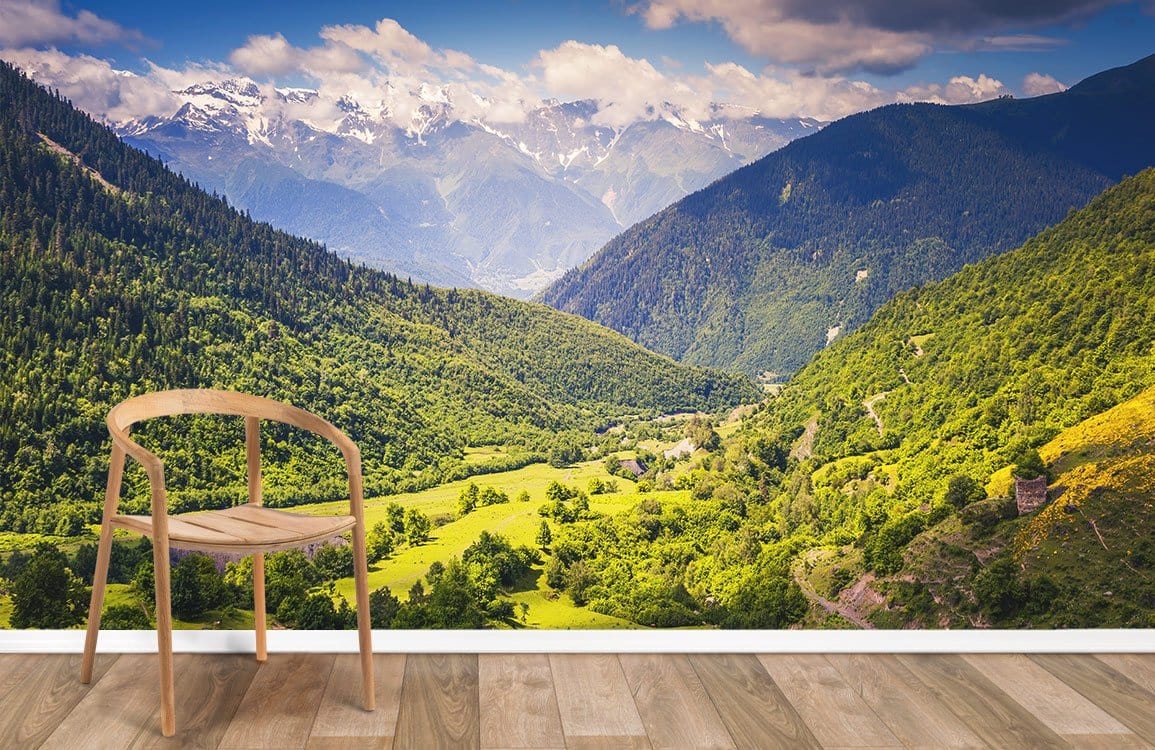 Wallpaper mural featuring a green woodland and a blue sky.