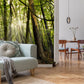 Wallpaper mural for bedroom decor with a forest scene with a slope and green trees.
