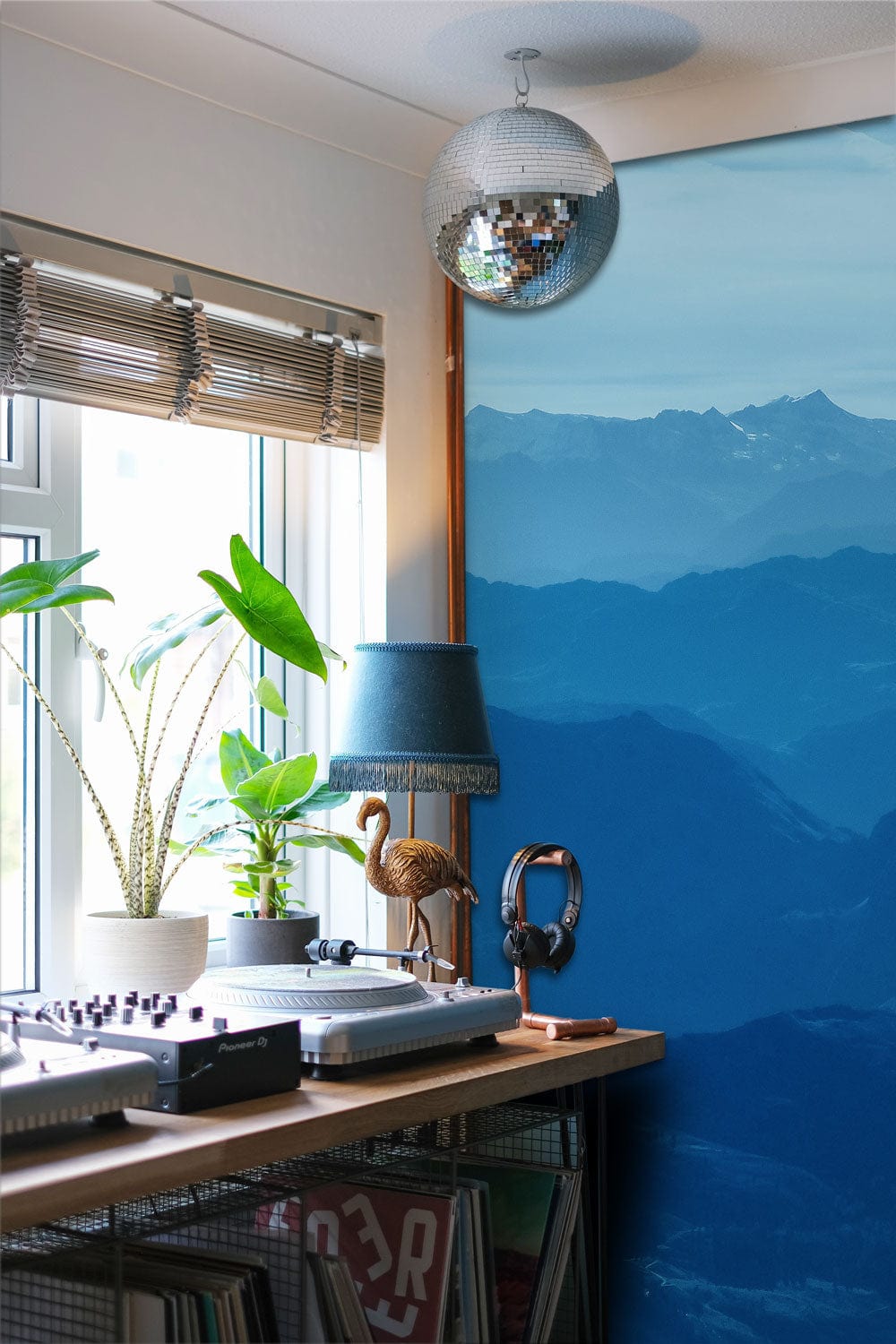 Wallpaper mural featuring hazy blue mountains for use as a hallway decoration
