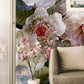 Wallpaper mural with large blooming floral patterns for use in decorating the living room.