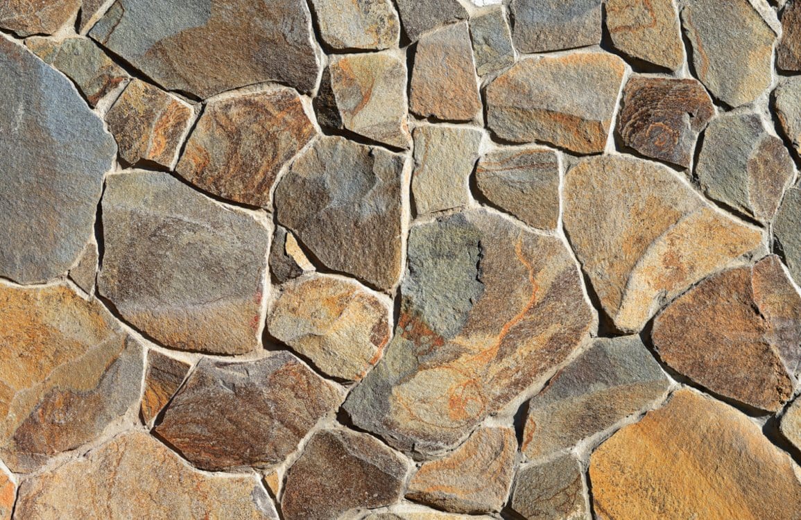 Home Decoration Featuring a Large Wallpaper Mural of Cracked Bricks