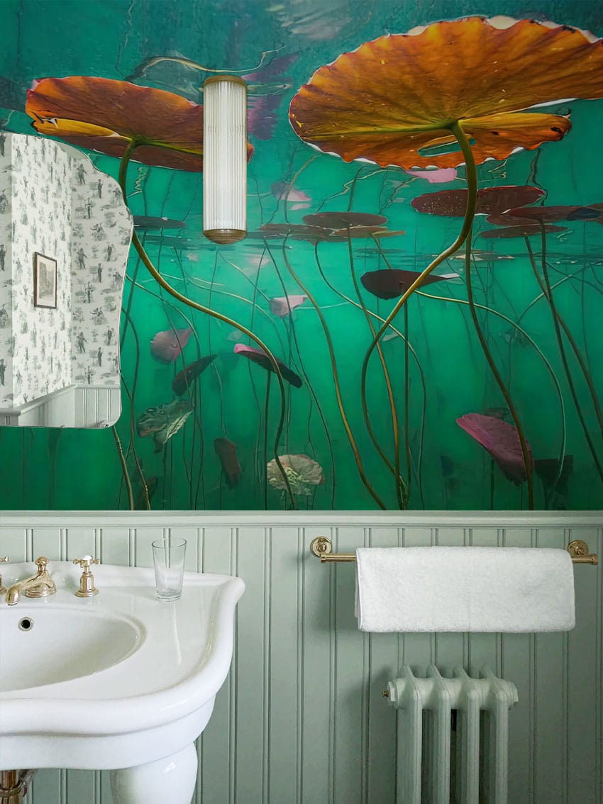 Wallpaper mural with lily pads floating underwater, perfect for use as bathroom decor.