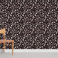 Wallpaper mural with a dark terrazzo pattern for use in interior decoration