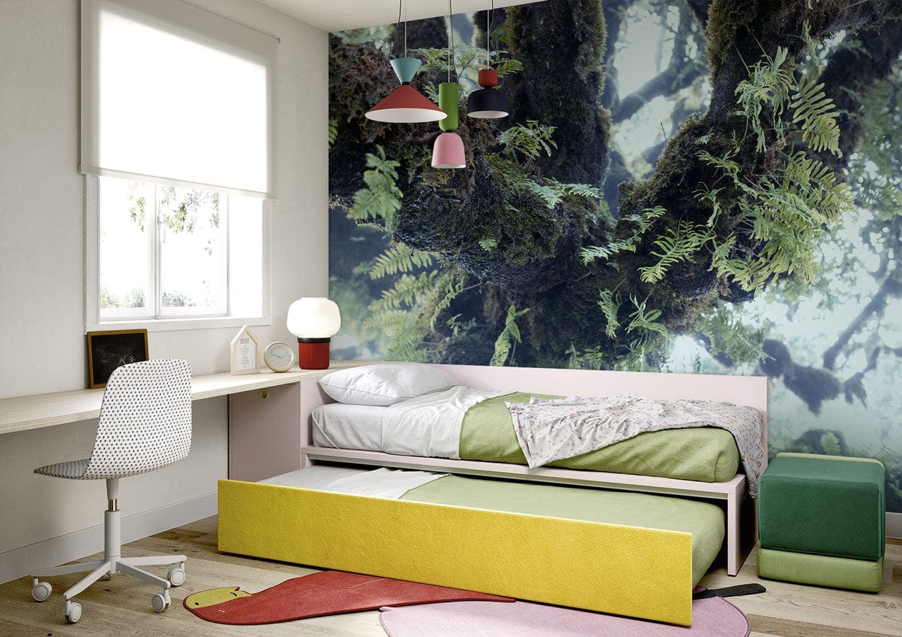 Wallpaper mural of a green forest scene inside a bedroom