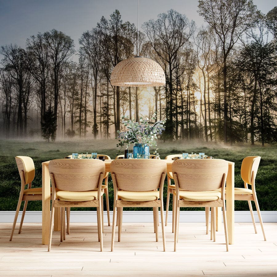 A mural of a misty forest at dawn on the dining room wall