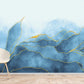 Wallpaper mural for home decoration with a blue watercolour painting with golden lines.