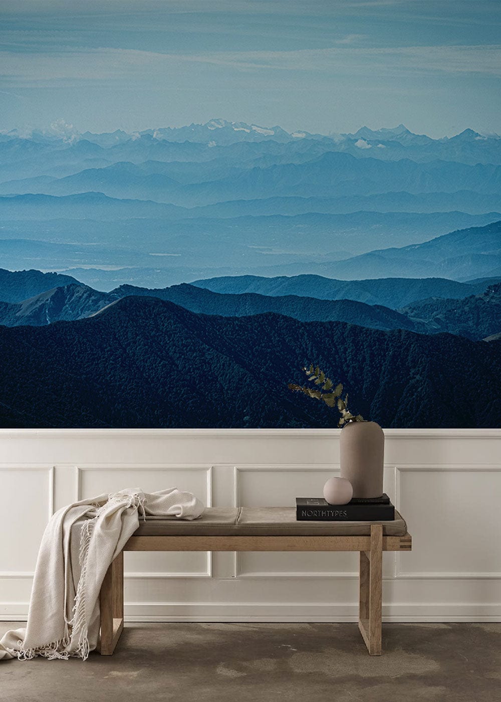Wallpaper mural of misty Rocky Mountains for use as decoration in hallways