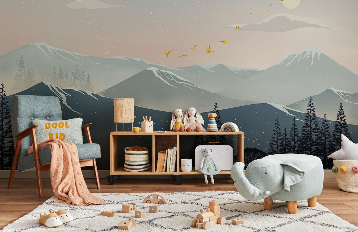 Wallpaper mural with a textured ombre mountain scene for use in decorating children's bedrooms