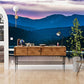 Wallpaper mural with a mountain range and a purple sunset, ideal for use in hallway decor