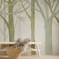 Wallpaper mural with a hazy wood forest scene, designed specifically for use in the living room.