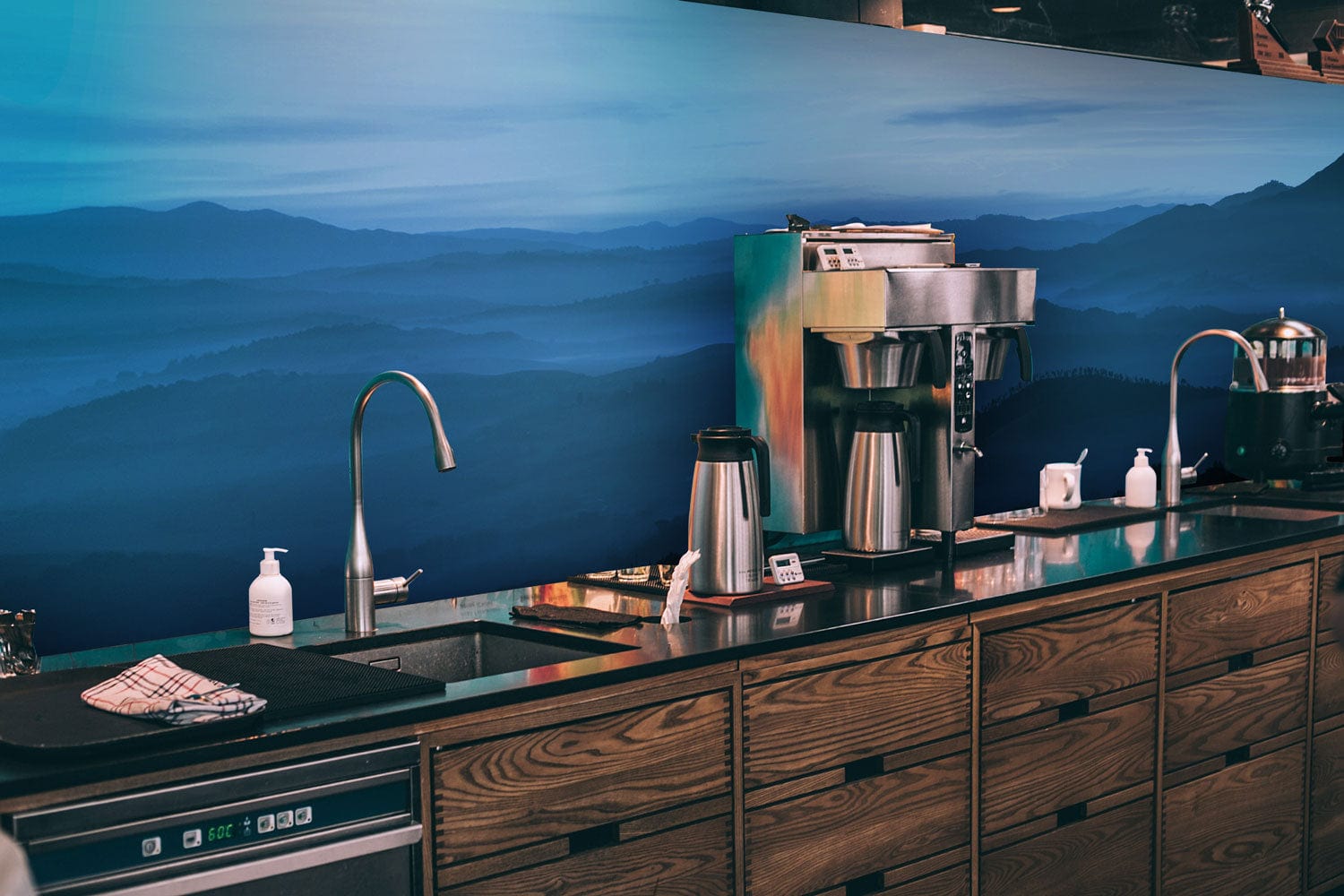 Wallpaper mural with ombre blue hilltops, perfect for decorating a coffee shop.