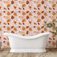 Wallpaper mural with a terrazzo and marble design in orange for the bathroom's decor.