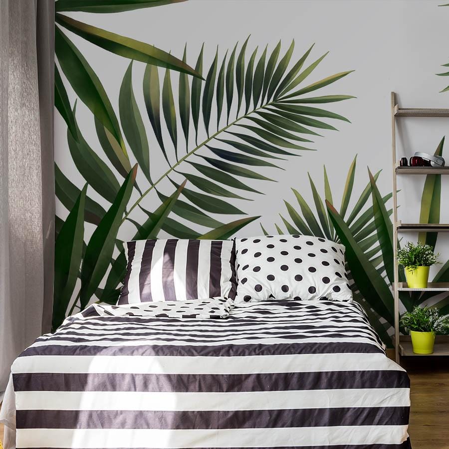 a design of enormous green palms on bespoke bedroom wall murals