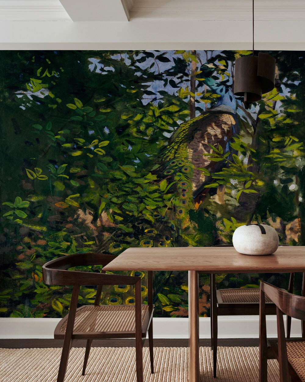 Wallpaper mural in the dining room depicting a peacock in the woods