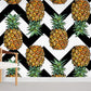 Wallpaper with ripe pineapples and waves in black.
