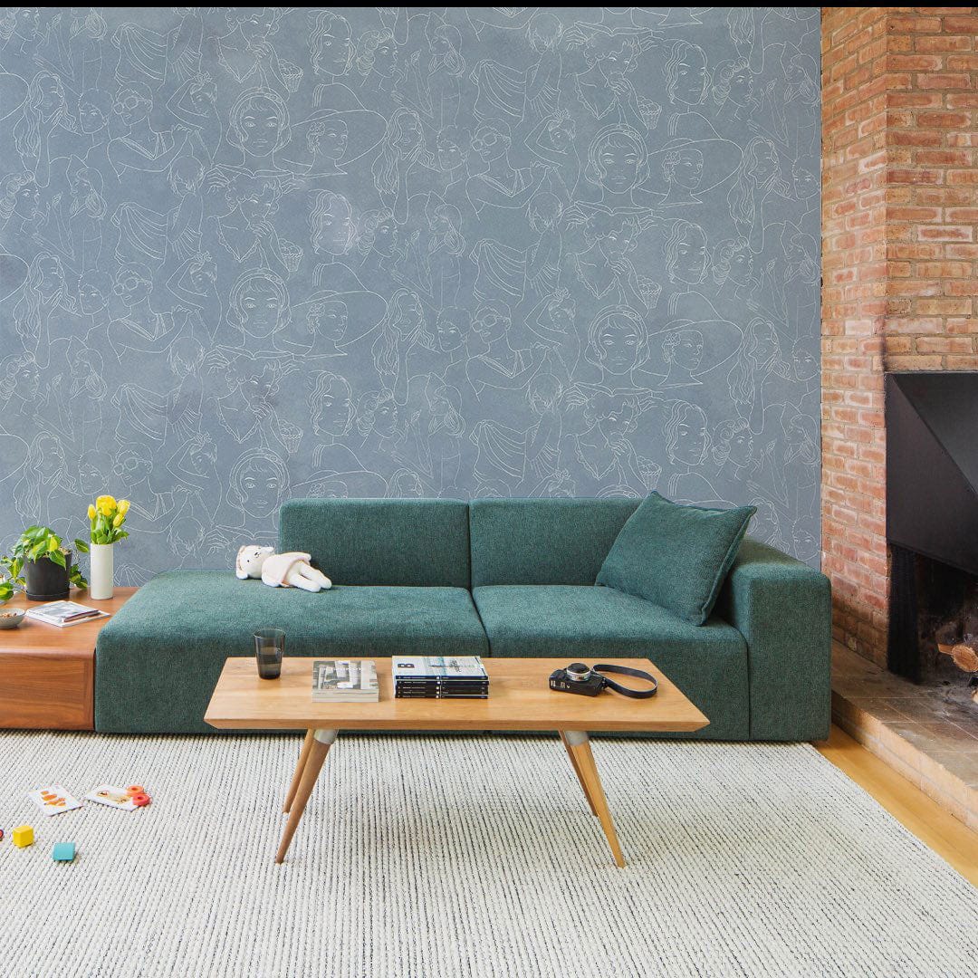 several portraits of people decorating the interior of a home's living room