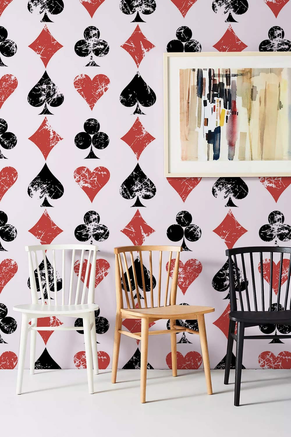 wallpaper mural decorating with paintings and chairs as a backdrop