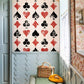 wallpaper with a red and black striped design in the hallway