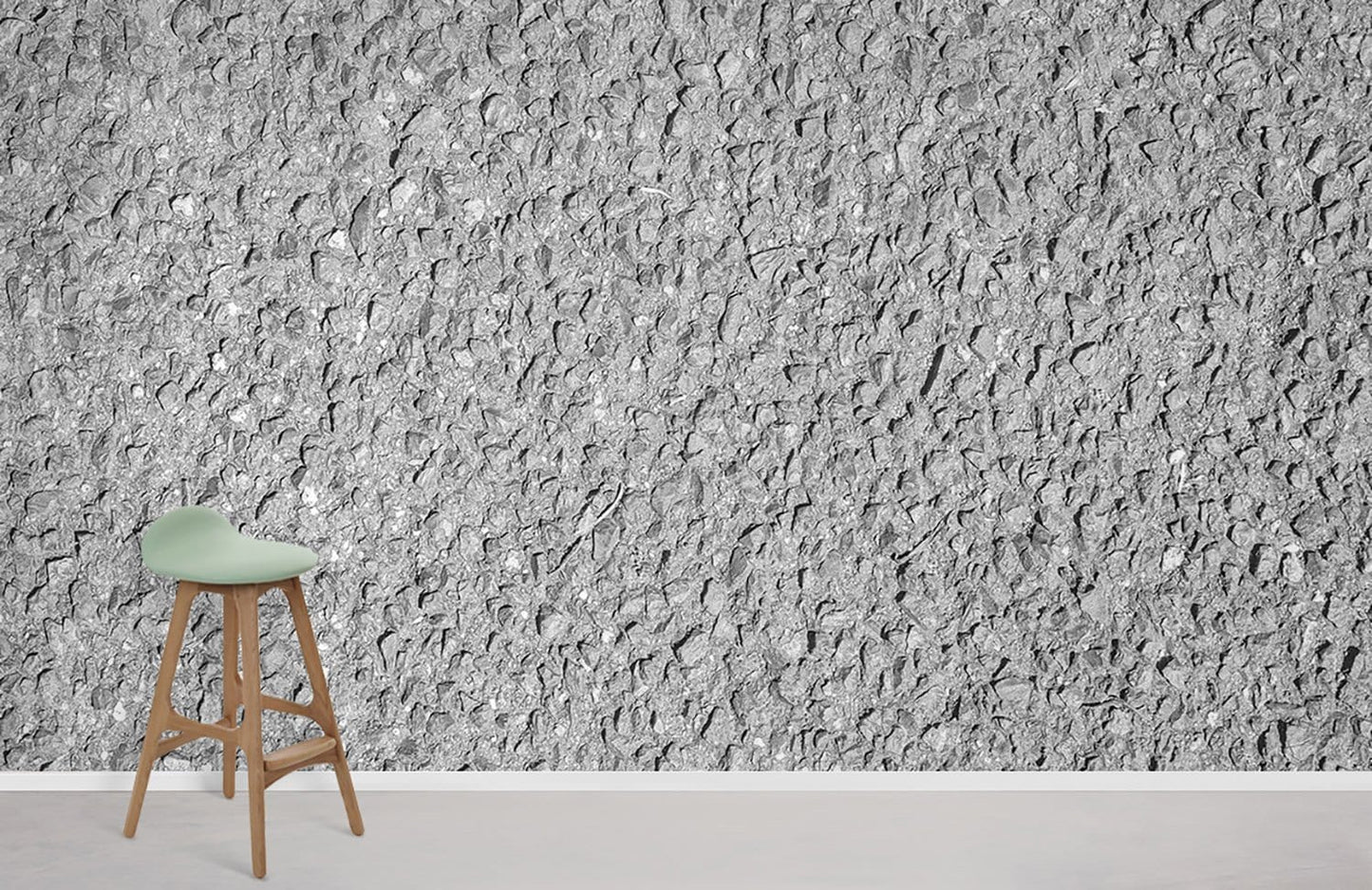 Wallpaper mural with an uneven grey texture for use as home decor.