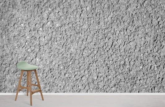 Wallpaper mural with an uneven grey texture for use as home decor.