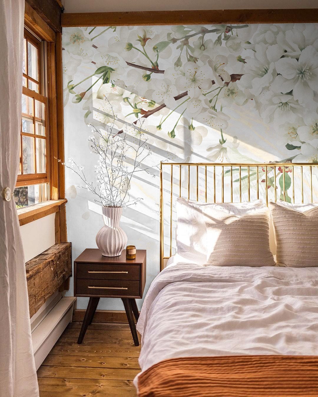 To decorate a bedroom, one might choose a wallpaper mural of pure pear tree blooms.