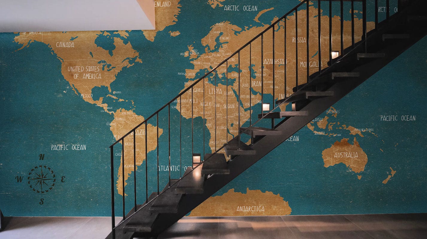 Mural wallpaper in the form of an old-fashioned map in turquoise for the hallway's decoration.