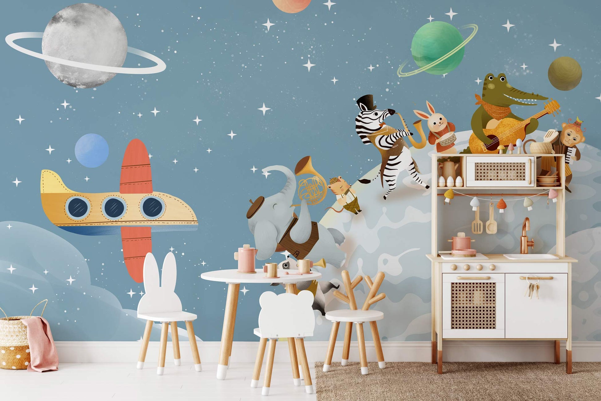 Wallpaper mural featuring roaming animals from the universe affixed on the wall in the nursery.