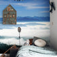 Wallpaper mural featuring a mountain landscape with clouds and sea for use in decorating a bedroom
