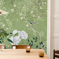 murals of fresh flowers and birds on a bright green background for the dining room's walls