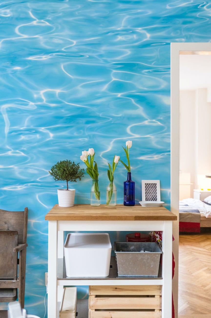 Wallpaper mural with sky blue waves for use as decoration in the hallway