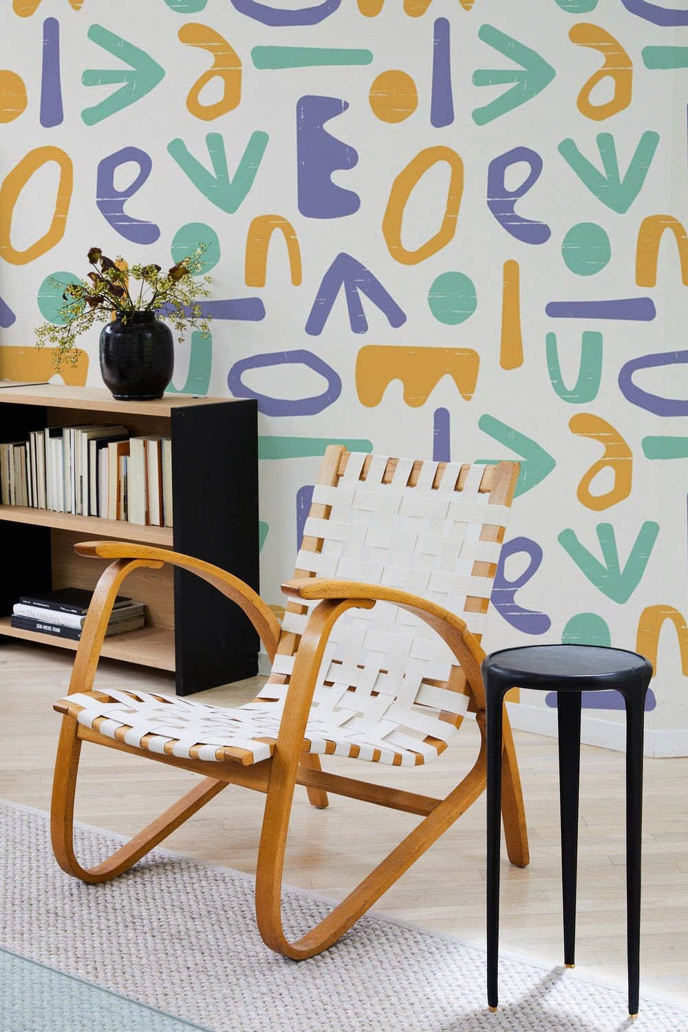 Mural wallpaper design featuring colourful letters, perfect for decorating the living room.